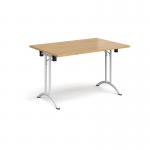 Rectangular folding leg table with white legs and curved foot rails 1200mm x 800mm - oak