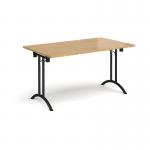 Rectangular folding leg table with black legs and curved foot rails 1400mm x 800mm - oak
