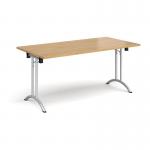 Rectangular folding leg table with silver legs and curved foot rails 1600mm x 800mm - oak