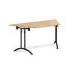 Trapezoidal folding leg table with black legs and curved foot rails 1600mm x 800mm - oak