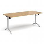 Rectangular folding leg table with silver legs and curved foot rails 1800mm x 800mm - oak