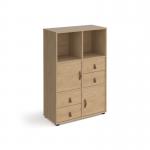 This photo features a tall cube storage unit measuring 1295mm high, complete with glides for easy movement. It includes 2 cupboards and 2 sets of drawers, all made of oak and with oak inserts for a sleek and modern look. Perfect for organizing and storing items in any room.