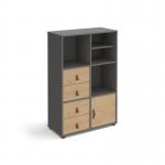 This image shows a grey cube storage unit with oak inserts, measuring 1295mm in height and equipped with glides. It also includes a matching shelf, cupboard, and two sets of drawers. This versatile unit is perfect for organizing any space with its universal design.