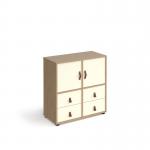 The Dams Cube Units Universal cube storage unit is a versatile and stylish piece of furniture. Standing at 875mm high, it features 2 cupboards and 2 sets of drawers for ample storage space. The unit is made of oak with white inserts and has glides for easy movement. It is a functional and modern addition to any room.
