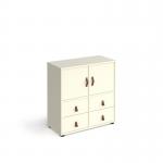 In the photo, you can see a tall white cube storage unit with drawers and cupboards, sitting on glides. The unit is 875mm high and has white inserts, creating a sleek and modern look. This versatile storage solution is perfect for any space.