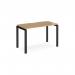 The Dams Bench Desking Adapt single desk features a sleek black frame and an elegant oak top, measuring 1200mm x 600mm. The contrast between the dark frame and warm wood creates a modern and professional look.