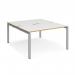 The Dams Bench Desking Adapt back to back desks feature a sleek silver frame with a white top and oak edging. Measuring 1400mm x 1600mm, this versatile desk is perfect for any modern office space. The back to back design allows for collaboration while maximizing space efficiency. Add a touch of sophistication to your workspace with this stylish and functional desk.