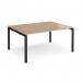 This photo showcases a sleek and modern Dams Bench Desking Adapt back to back desk. The 1600mm x 1200mm size, black frame, and beech top create a professional and contemporary workspace.