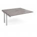 This bench desk add on unit features a sleek silver frame and a grey oak top. It measures 1600mm by 1600mm and is designed to seamlessly adapt to your workspace. The simplistic design and modern color palette make it a versatile addition to any office setting.