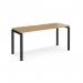 The photo shows a sleek and modern Dams Bench Desking Adapt single desk in black frame and oak top. The desk measures 1600mm x 600mm, providing ample workspace. The design is both functional and stylish, making it a great addition to any office or workspace.