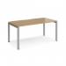 A sleek and modern desk that features a silver frame and oak top. Its 1600mm x 800mm size provides ample workspace. Perfect for any office setting.