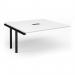 The photo shows a sleek and modern conference room with a large boardroom table. The table has a black frame and a white top, with an additional add-on unit in the center. The unit has a cutout in the middle and measures 272mm x 132mm. The overall size of the table is 1600mm x 1600mm. The design is versatile and perfect for any professional setting.