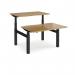 Elev8 Touch sit-stand back-to-back desks 1200mm x 1650mm - black frame, oak top EVTB-1200-K-O