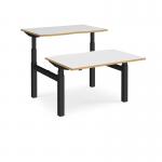 Elev8 Touch sit-stand back-to-back desks 1200mm x 1650mm - black frame, white top with oak edge EVTB-1200-K-WO