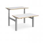 Elev8 Touch sit-stand back-to-back desks 1200mm x 1650mm - silver frame and white top with oak edge