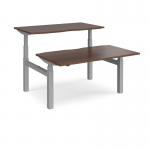 Elev8 Touch sit-stand back-to-back desks 1400mm x 1650mm - silver frame and walnut top