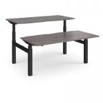 Elev8 Touch sit-stand back-to-back desks 1600mm x 1650mm - black frame and grey oak top
