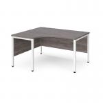 Maestro 25 left hand ergonomic desk 1400mm wide - white bench leg frame and grey oak top