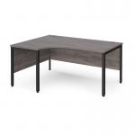 Maestro 25 left hand ergonomic desk 1600mm wide - black bench leg frame and grey oak top