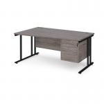 Maestro 25 left hand wave desk 1600mm wide with 2 drawer pedestal - black cantilever leg frame, grey oak top MC16WLP2KGO