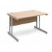 The photograph shows a sleek and modern Dams International Desking Momento straight desk. Its dimensions measure 1200mm x 800mm, providing ample workspace for productivity. The desk features a silver cantilever frame, adding a touch of sophistication to its design. The top is made of a warm and inviting beech wood, bringing a natural element to the desks appearance. Overall, this desk exudes a professional and contemporary aesthetic, perfect for any modern workspace.