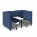 The photo features a Dams Coffee Tables Muse 4-person fabric booth in shades of white, black, blue, and grey. The booth has a sleek white table and black legs, with the seats upholstered in a deep blue hue and the backs and infill in a light grey color. The overall look is modern, chic, and inviting.