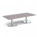 This image features Dams Coffee Tables Pisa rectangular coffee table with round chrome bases. The table measures 1800mm x 800mm and is made of grey oak. The chrome bases give the table a modern touch, while the grey oak adds a touch of warmth. The sleek design and neutral color of this coffee table make it a versatile addition to any living space.
