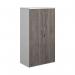 This image features a modern white double door cupboard, standing at 1440mm tall. The doors are a sleek grey oak color and the cupboard contains 3 shelves for storage.