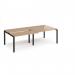 The image shows two back-to-back sliding top desks with a black frame and beech top. The desks are 2400mm x 1200mm and are designed to adapt to various workspaces.