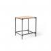 This picture features a stylish Turin square side table with a sleek anthracite steel frame and a beautiful Alaska top. The combination of materials creates a modern and functional piece, perfect for any living space.