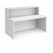 The photograph depicts a white reception desk measuring 1662mm in width. The modern design features sleek lines, a spacious top counter, and side panels with detailed cutouts. The desk is a central focal point with a welcoming and inviting feel for any reception area.