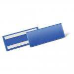 The photograph shows a blue adhesive ticket holder document pocket, measuring 210 x 74mm, with a durable warehouse signage design. The pack contains 50 of these pockets.