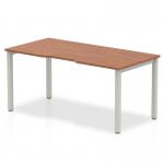 The photograph features a sleek, modern office desk with a walnut top and silver frame. Its dynamic bench design allows for flexible workspace arrangements. Perfect for a professional and efficient work environment.