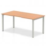 This picture shows a Dynamic Bench Desking Evolve Plus 1200mm Single Starter Office Bench Desk. It features an oak top with a silver frame, providing a sleek and modern look. The spacious surface is perfect for working, and the sturdy construction ensures durability.