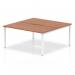 The Dynamic Bench Desking Evolve Plus 1600mm B2B 2 Person Office Bench Desk boasts a sleek, modern design with a walnut top and white frame. Its spacious surface comfortably accommodates two people, making it ideal for collaborative work environments.