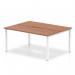 In the photograph, the Dynamic Bench Desking Evolve Plus 1400mm B2B 2 Person Office Bench Desk is shown with a sleek walnut top and a contemporary white frame. The spacious design is perfect for two people to work comfortably in a modern office setting.