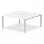The picture is of a sleek, modern white desk with a silver frame. It is designed to comfortably seat two people and has a curved shape for collaborative work. The desk is part of the Evolve Plus series and is 1600mm in length.