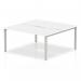 The picture is of a sleek, modern white desk with a silver frame. It is designed to comfortably seat two people and has a curved shape for collaborative work. The desk is part of the Evolve Plus series and is 1600mm in length.