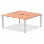 This photo shows a sleek and modern 2 person office bench desk with a beechwood top and a silver frame. The dynamic design of the desk allows for comfortable and productive workspaces.