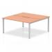 This photo shows a sleek and modern 2 person office bench desk with a beechwood top and a silver frame. The dynamic design of the desk allows for comfortable and productive workspaces.