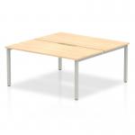 This photograph showcases the sleek and modern design of a Dynamic Bench Desking Evolve Plus 1600mm 2 person office bench desk. The maple top and silver frame create a clean and professional look, perfect for a contemporary workspace.