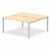 This photograph showcases the sleek and modern design of a Dynamic Bench Desking Evolve Plus 1600mm 2 person office bench desk. The maple top and silver frame create a clean and professional look, perfect for a contemporary workspace.