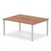 The dynamic bench desking Evolve Plus 1200mm B2B 2 person office bench desk features a sleek, modern design with a rich walnut top and silver frame. The spacious workspace allows for two individuals to comfortably work side by side. The desk is both stylish and functional, making it perfect for any office setting.