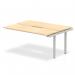 The image shows a modern office bench desk with a maple top and silver frame. It features a sleek and dynamic design, with enough space for two people to work comfortably. The desk promotes collaboration and productivity in a professional environment.