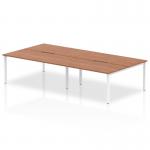 This photo features a sleek and modern Dynamic Bench Desking Evolve Plus 1600mm B2B 4 Person Office Bench Desk. Its walnut top and white frame create a clean and professional aesthetic, making it a great choice for any office space.