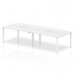 The photograph shows a dynamic bench desking setup featuring the Evolve Plus 1200mm desk with a white top and white frame. This four-person office bench desk offers a clean, modern look with ample workspace for collaboration and productivity.