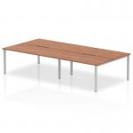 The Dynamic Bench Desking Evolve Plus 1600mm B2B 4 Person Office Bench Desk features a stylish and modern design. The walnut top adds a touch of warmth, while the silver frame adds a sleek contrast. The bench desk provides ample space for four people to work comfortably.