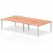 The photo shows a modern and versatile office bench desk, with a 1600mm beech top and a silver frame. It can accommodate four people, making it ideal for team collaboration. The dynamic design adds a sleek touch to any work environment.