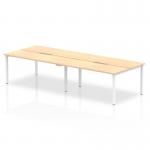 The picture shows a modern and sleek office setup with four people working on 1400mm maple top benches. The silver frames add a touch of elegance to the dynamic bench desking setup.