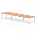 This image features a modern and versatile office workspace with a 1200mm oak top and a sleek white frame. The dynamic bench desking system comfortably accommodates 6 people and promotes a collaborative environment.